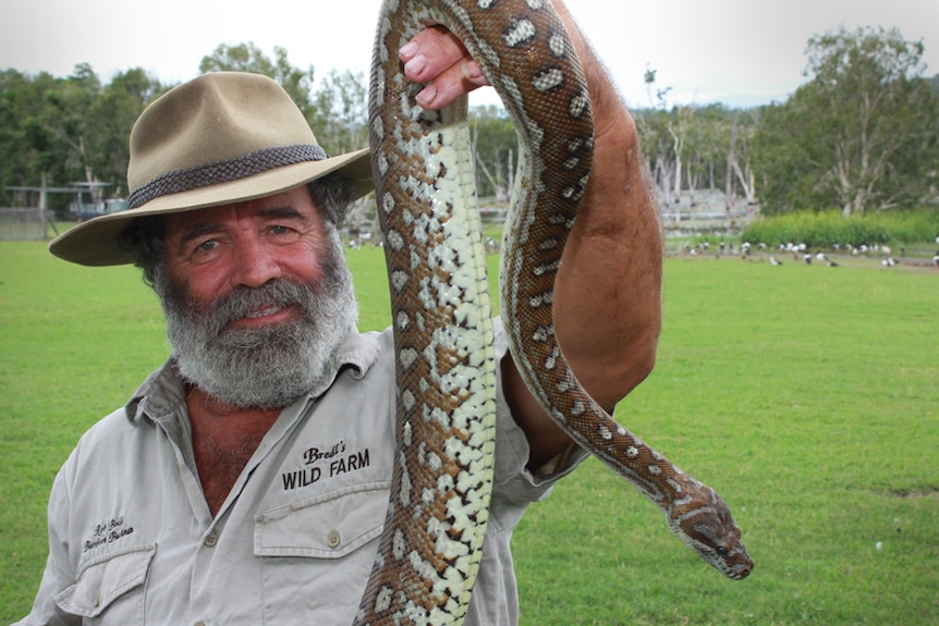 rob Bredl holdng a long snake