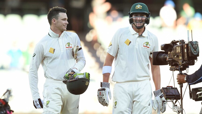 Peter Handscomb and Matt Renshaw walk off after win over Proteas