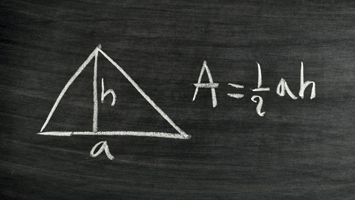 An algebra equation written in chalk on a blackboard