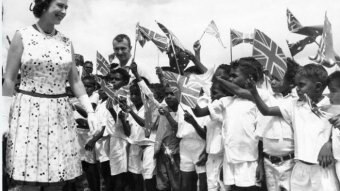 Indigenous boys waving Union Jacks greet Queen Elizabeth in Cooktown in 1970.