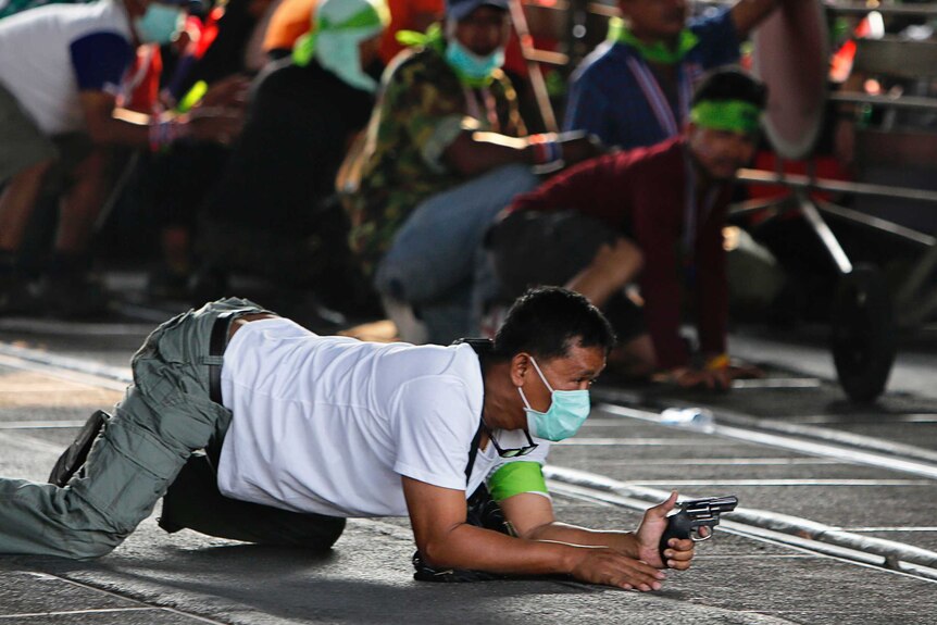 Thai protester with gun during demonstrations