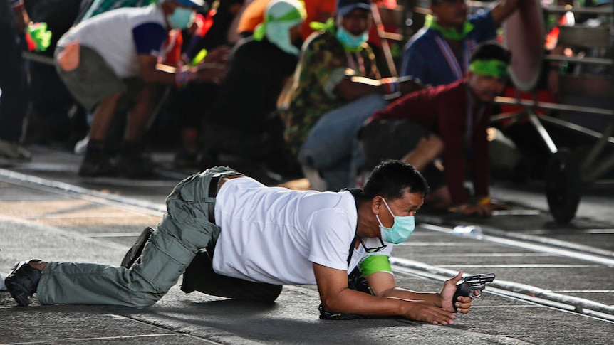 Thai protester with gun during demonstrations