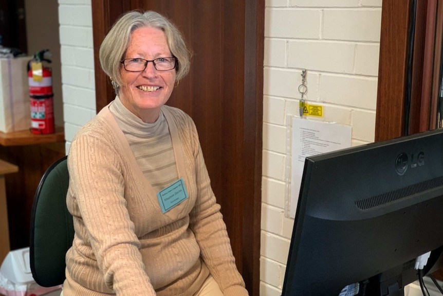 Bunbury Seniors Computer Club secretary Maureen Davies sitting at a computer at the club.