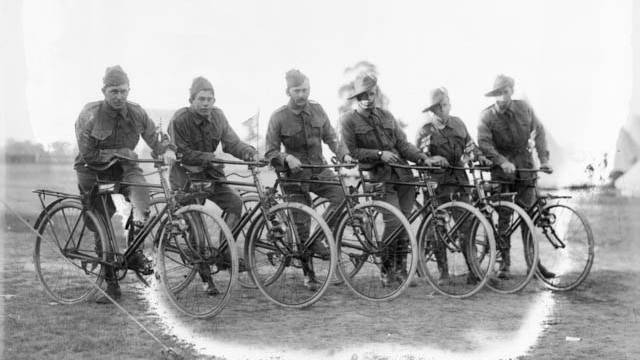 A group of Australian men sit on their bikes during World War I.