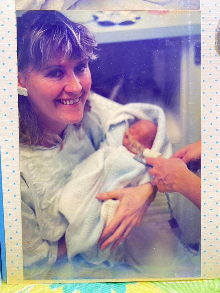 Gail Heeney holding her newborn son. 