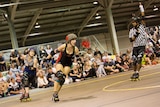 A roller derby game in action.
