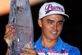 Rickie Fowler poses with Players Championship trophy