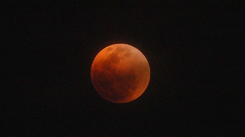 The shadow of the earth completely covered the moon, turning it red.