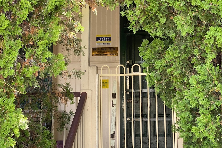 Dr Stuart Reece plaque at front door of closed clinic