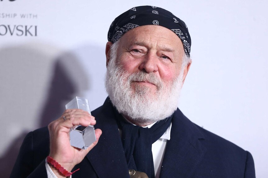 Bruce Weber poses for photographers at the Fashion Awards.