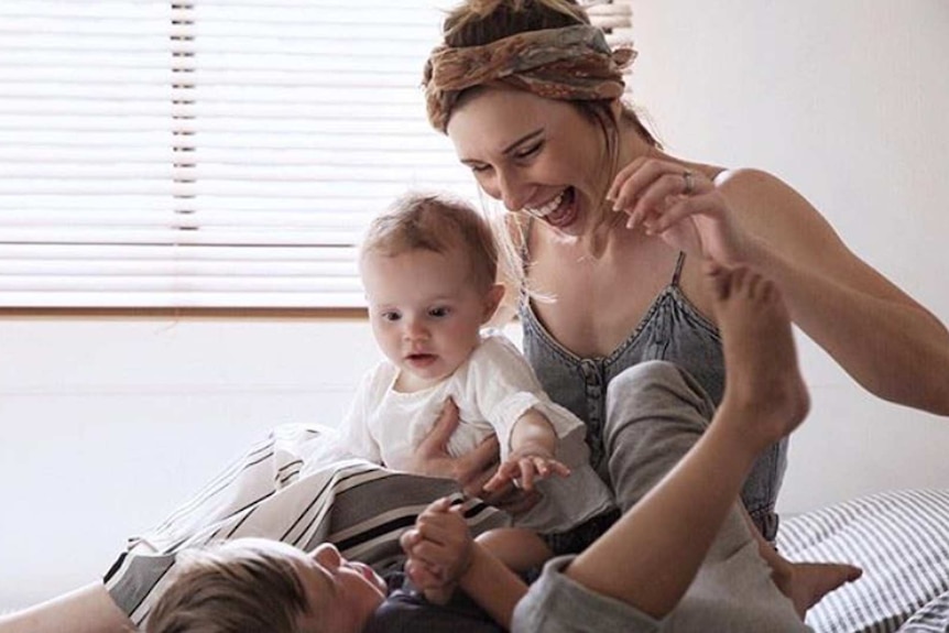 Mum Danielle Symes with her kids Charlie and Harper for a story about why parents are choosing masculine names for their girls.