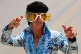 Ross Murphie dressed in a Hawaiian-themed Elvis jumpsuit.