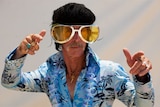 Ross Murphie dressed in a Hawaiian-themed Elvis jumpsuit.