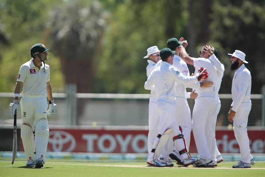 First wicket down... Ed Cowan walks off after being caught at slip.