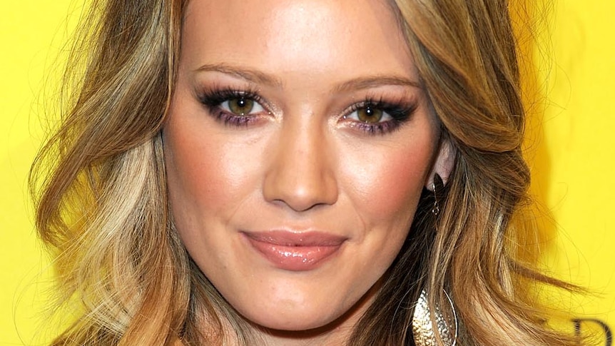 Hilary Duff smiles for photos