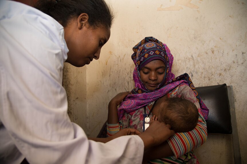 Mother and child seeking medical help in Ethiopia