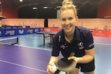 A young woman playing table tennis