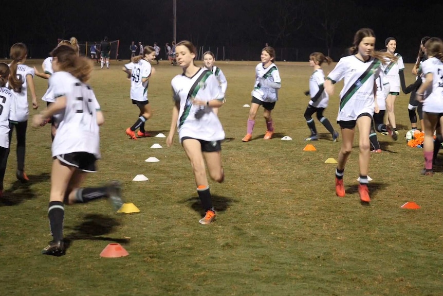Players from the Kahibah Football Club Girls Under 13s team training.