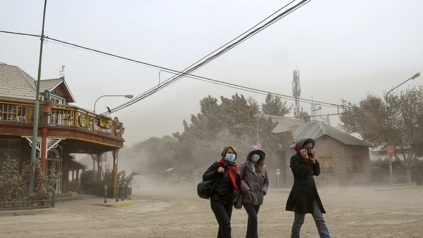 Residents wearing surgical masks to protect themselves against ash from Calbuco volcano