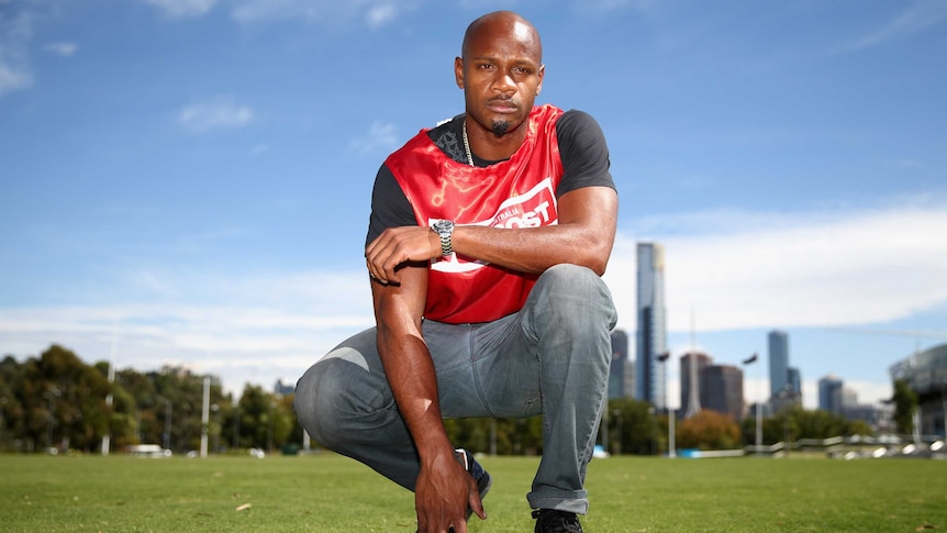 Asafa Powell poses for the media ahead of the 2013 Stawell Gift.