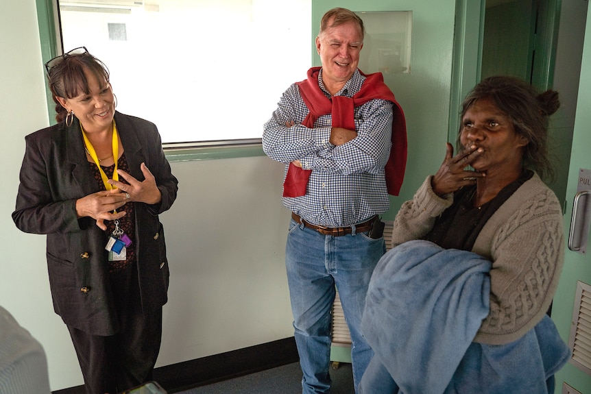 Father Mick with Natalie Craigie and a client at Arthur Peterson centre