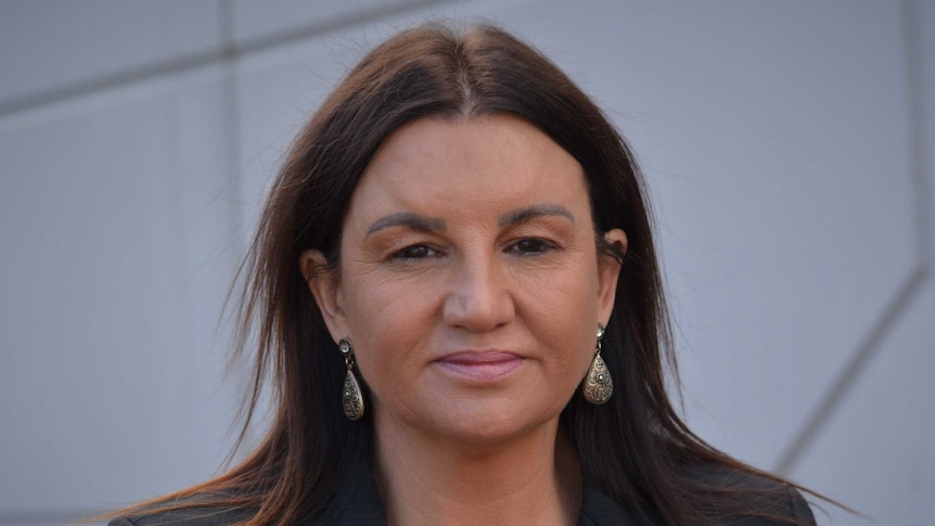 Jacqui Lambie looks at the camera.