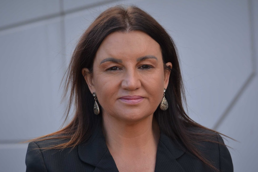 Jacqui Lambie looks at the camera.