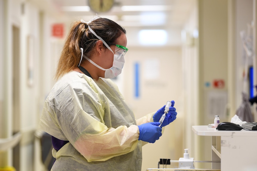 Nurse preparing for injection