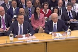 News Corporation boss Rupert Murdoch and son James answer questions at parliament. (Reuters)