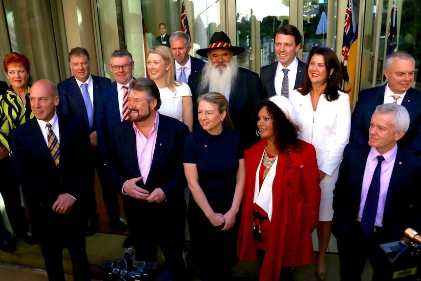 Fifteen new Australian Senators smile in a group photo for Senate school.