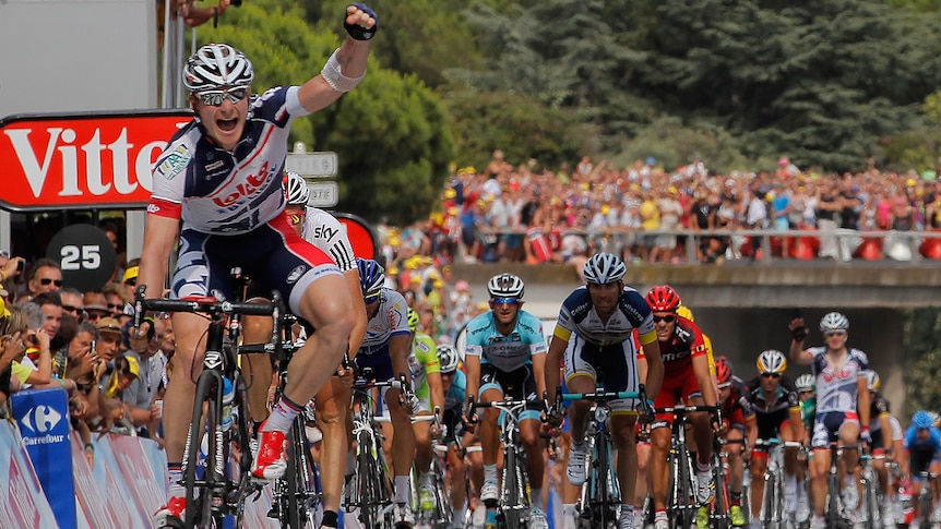 Andre Greipel salutes as he seals victory on the 13th stage.
