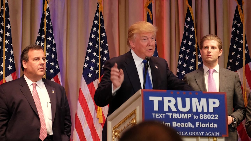 Chris Christie joins Donald Trump on the stage following Super Tuesday