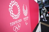 Close-up shot of two logos, one with the five Olympic rings, the other with the Paralympic symbol.