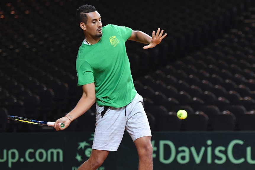 Nick Kyrgios belts a forehand at Davis Cup practice