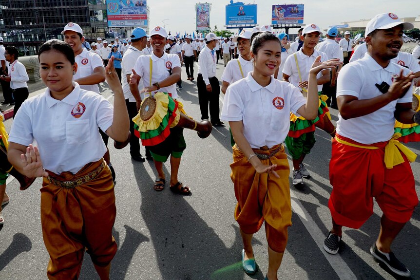 Dancers lead a rally in Phnom Penh
