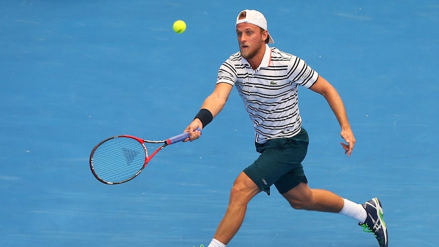 American Denis Kudla plays a forehand against Dominic Thiem at the Brisbane International.