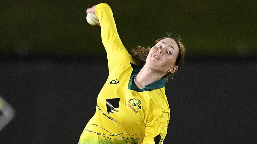 Amanda-Jade Wellington with the ball in the back of her hand as she bowls for Australia against England in an ODI.