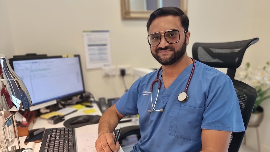 a doctor sitting at his desk