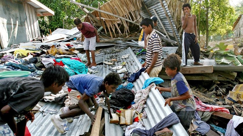Children hunt for clothes in a tsunami affected area of the Solomon Islands. (File photo)