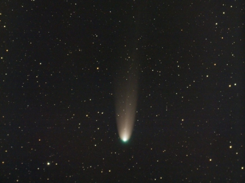 A circle of light against a black star speckled backdrop.