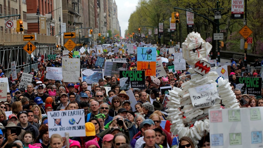 Protesters line Central Park West during the Earth Day demonstration to coincide with similar marches globally