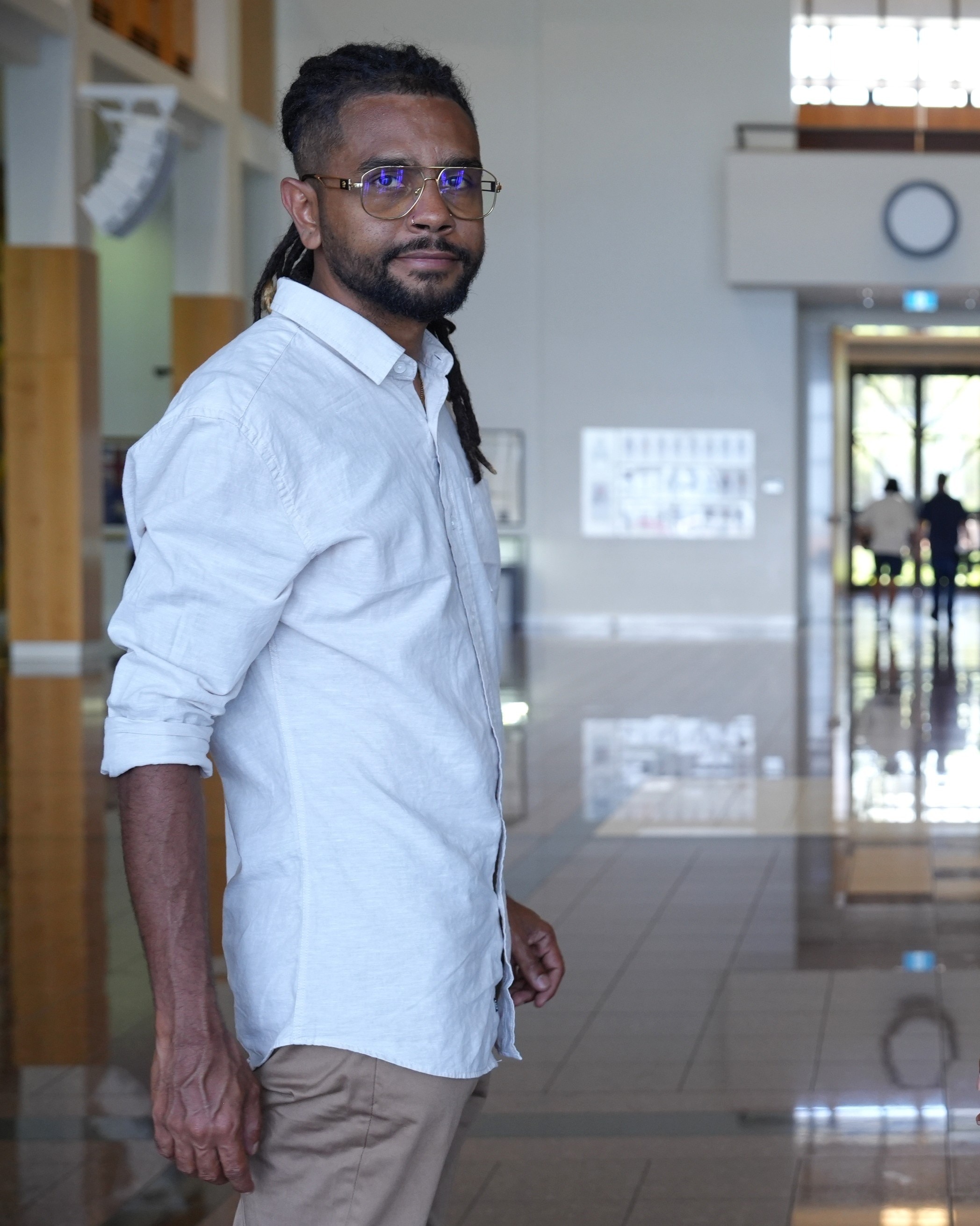 Yiwarr McGrath standing inside parliament