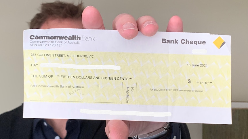 Tim holds a CBA cheque for just over $15.
