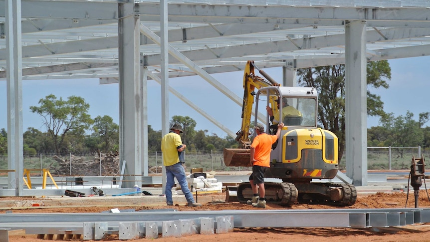 Workers at the new abattoir under construction outside Bourke.