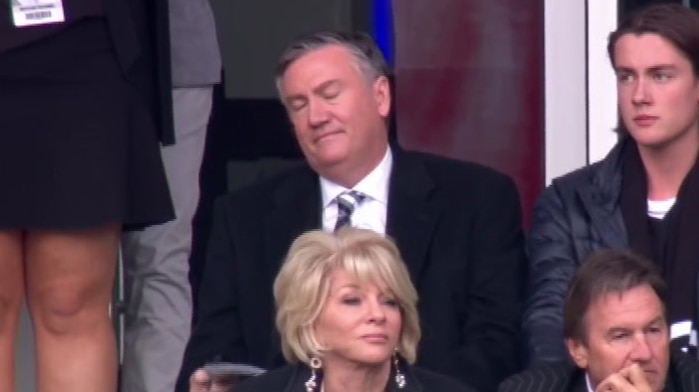 Eddie McGuire closes his eyes and looks down in the final minute of the match, from his seat in the stands.