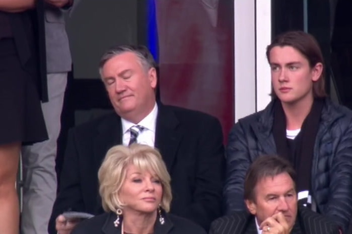 Eddie McGuire closes his eyes and looks down in the final minute of the match, from his seat in the stands.