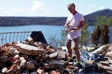 Greg Webb in the rubble of his home