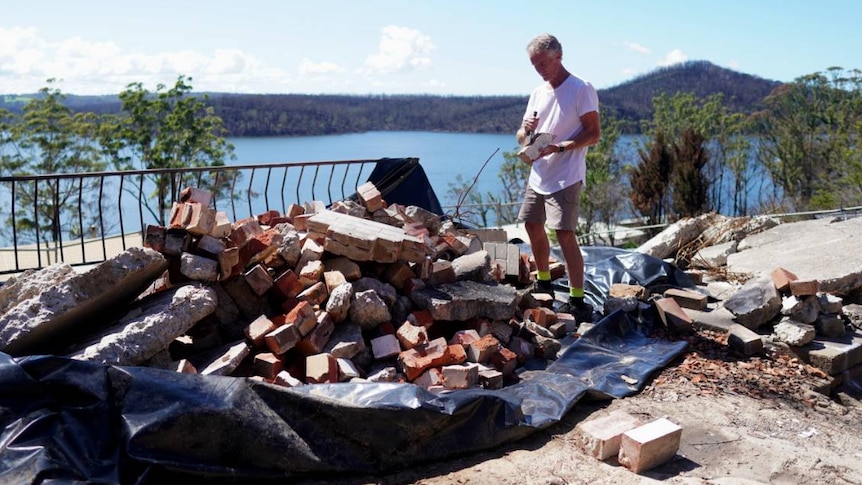 Greg Webb in the rubble of his home