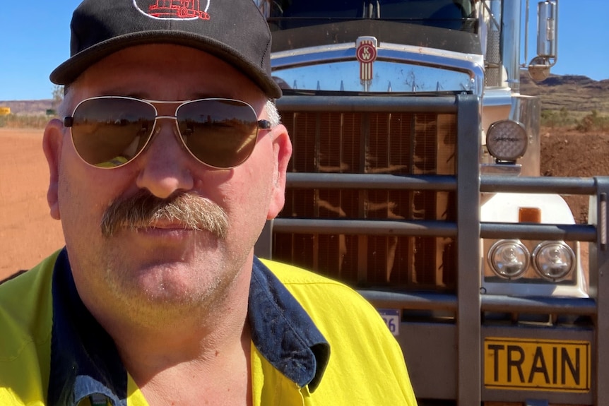 Mr Williams in front of his truck.