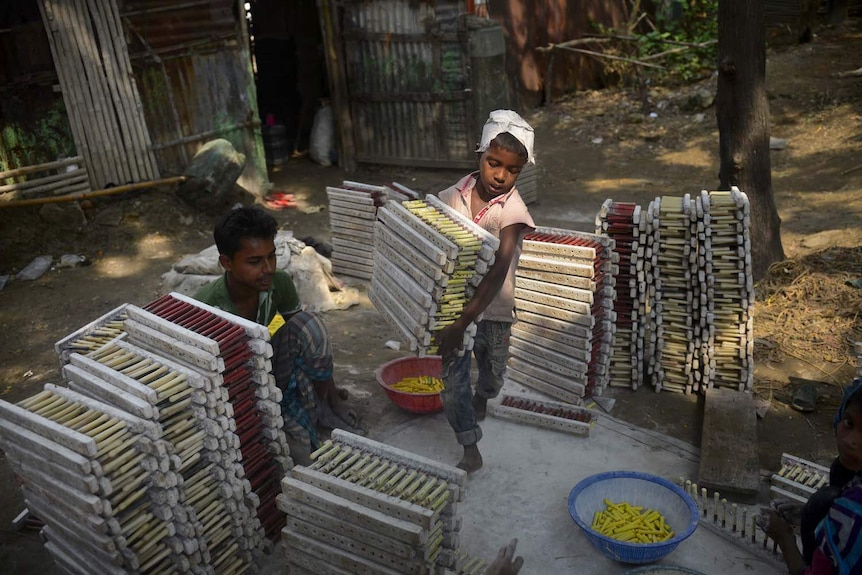 A Bangladeshi child works at balloon factory in Dhaka